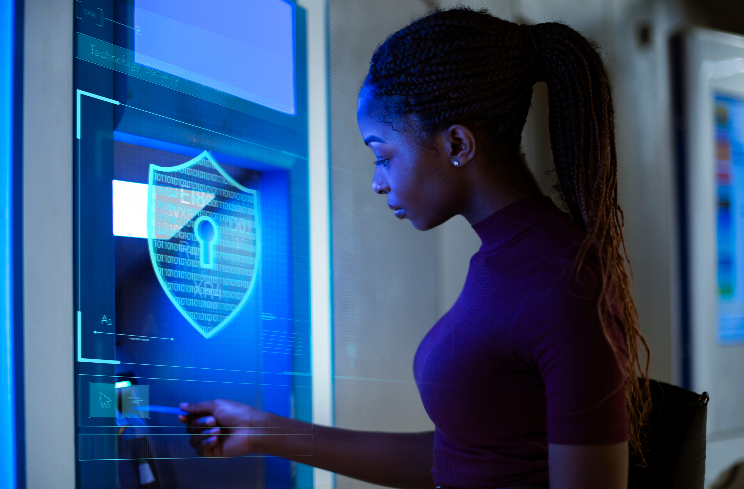 Women inserting credit card into a safe ATM machine